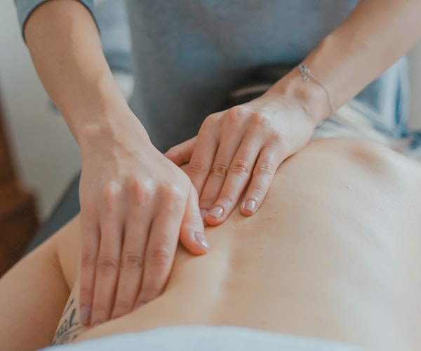 Chiropractor performing spinal adjustment